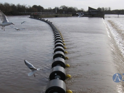 Traffic Control Booms in the overflow of the river that are used to create a safety barrier to prevent even the smallest of craft from passing through