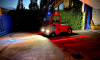 red series 400 tow tractor as intralogistic equipment in the night with the Bright lights  thumbnail