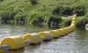 yellow traffic control booms in the waterway thumbnail