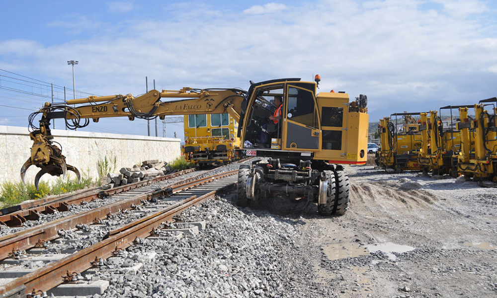 Side view of Road Rail Loader in maintenance operation on the train track