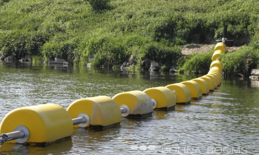 yellow traffic control booms in the waterway