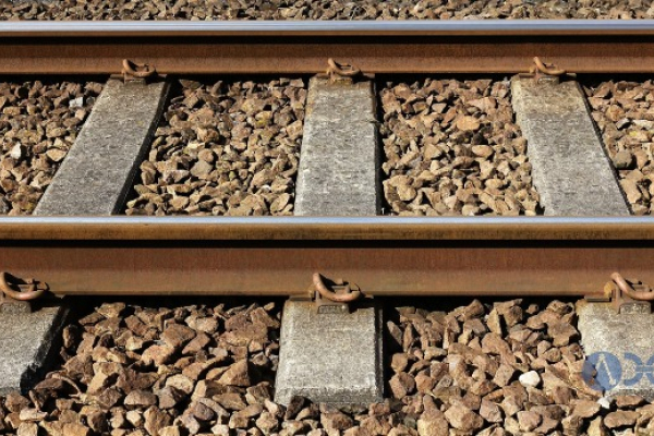 Railway ballast that surrounds railroad tracks