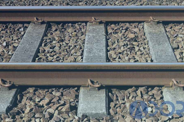 Railway ballast that surrounds railroad tracks