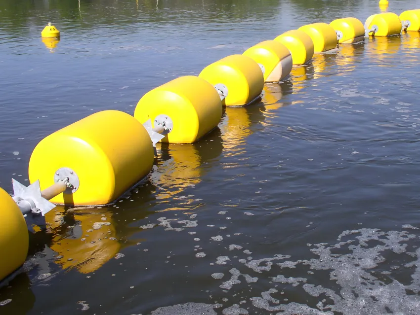 Floating security barrier in waterway