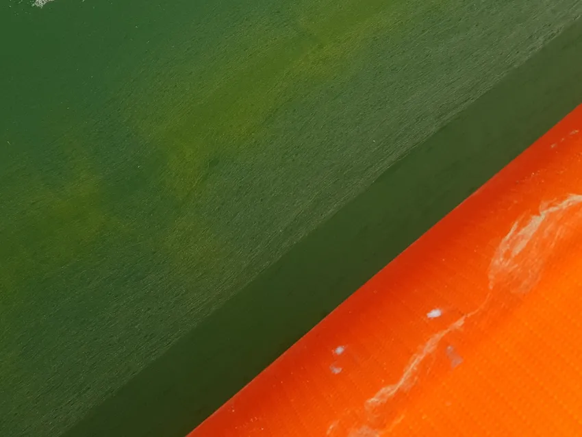 Inflatable oil boom close-up on water