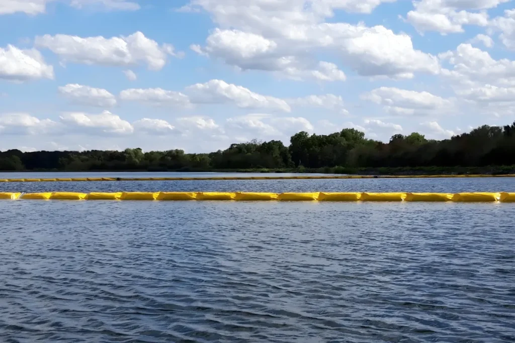 Oil containment boom floating on water for spill control
