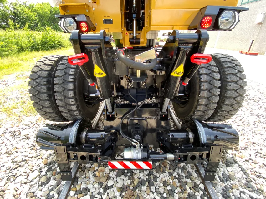 Hi rail excavator rail wheel system for road-rail operation on railway tracks