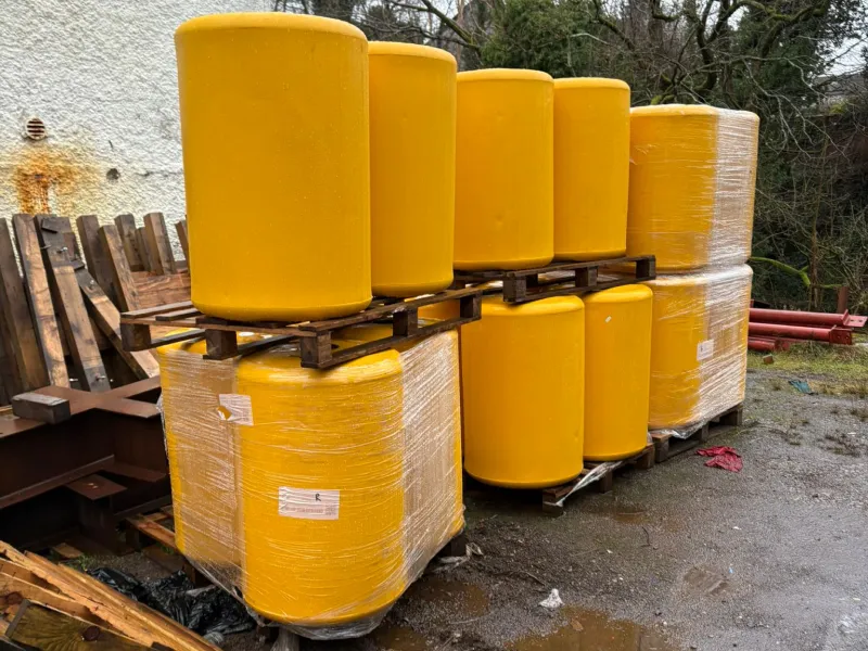 Yellow log screen boom floats in storage