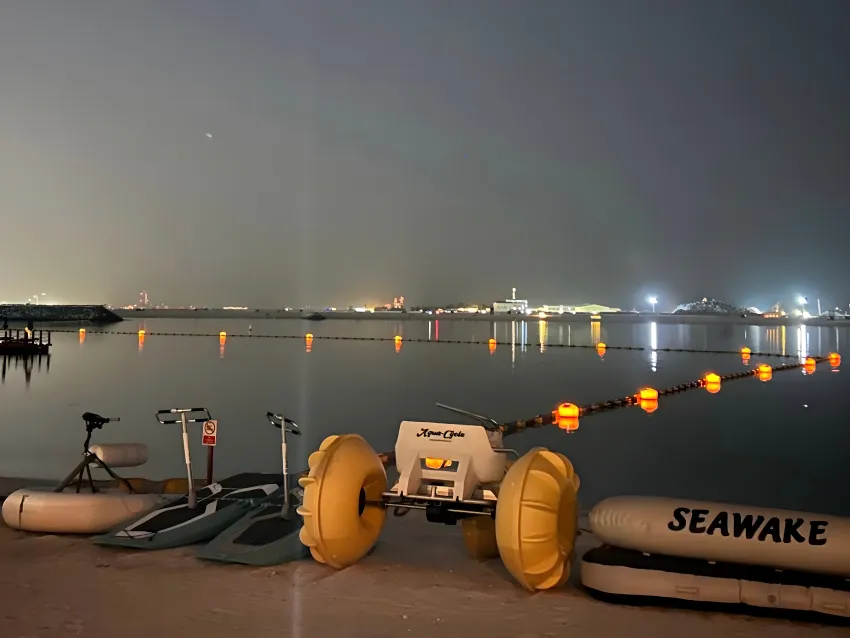 Lighted mooring buoys marking waterway at night