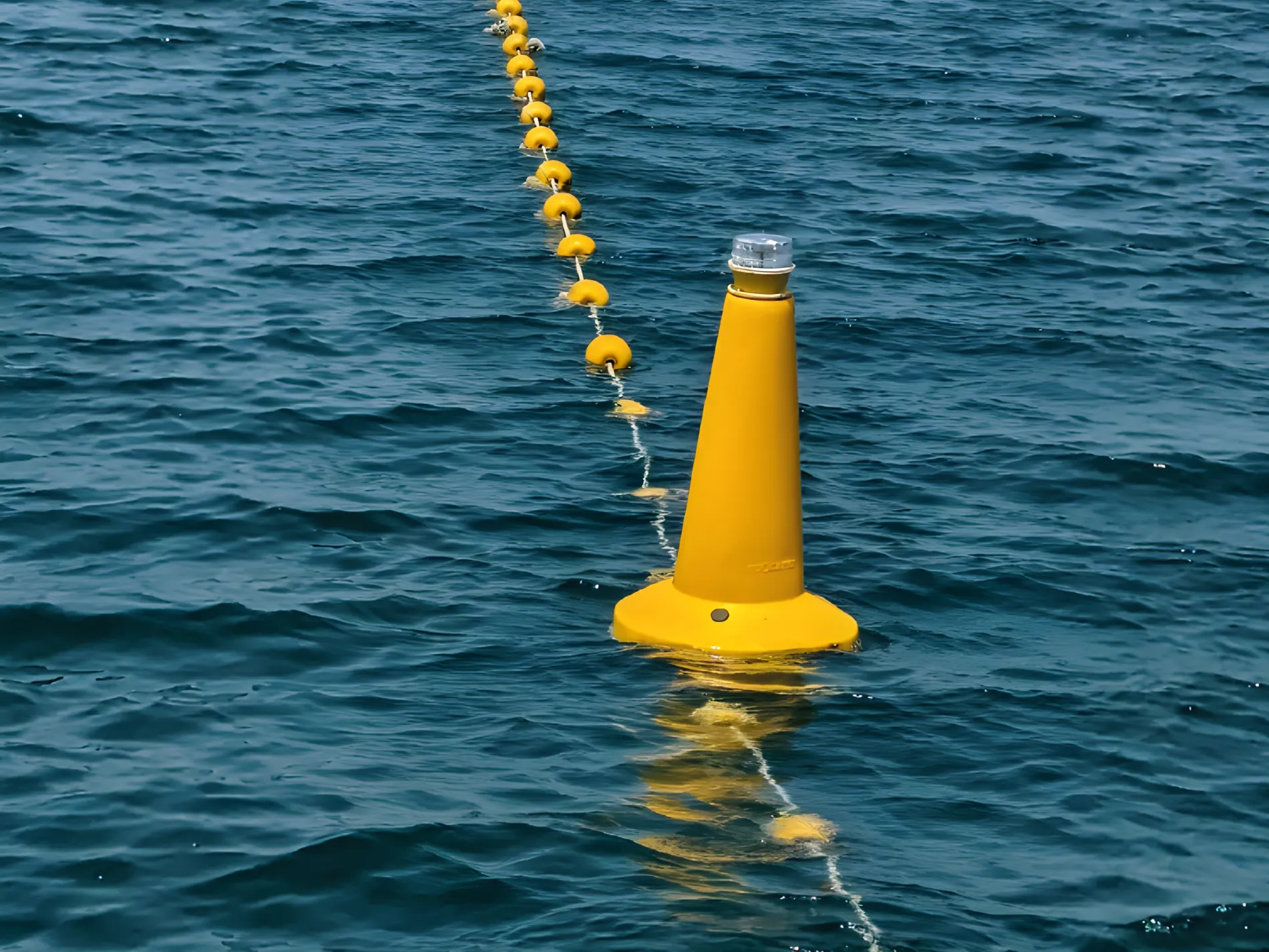 Yellow marine lantern buoy on open water