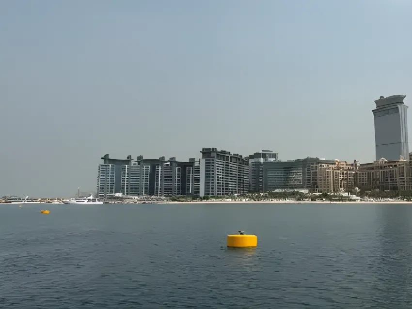 Mooring buoy floating near coastal buildings