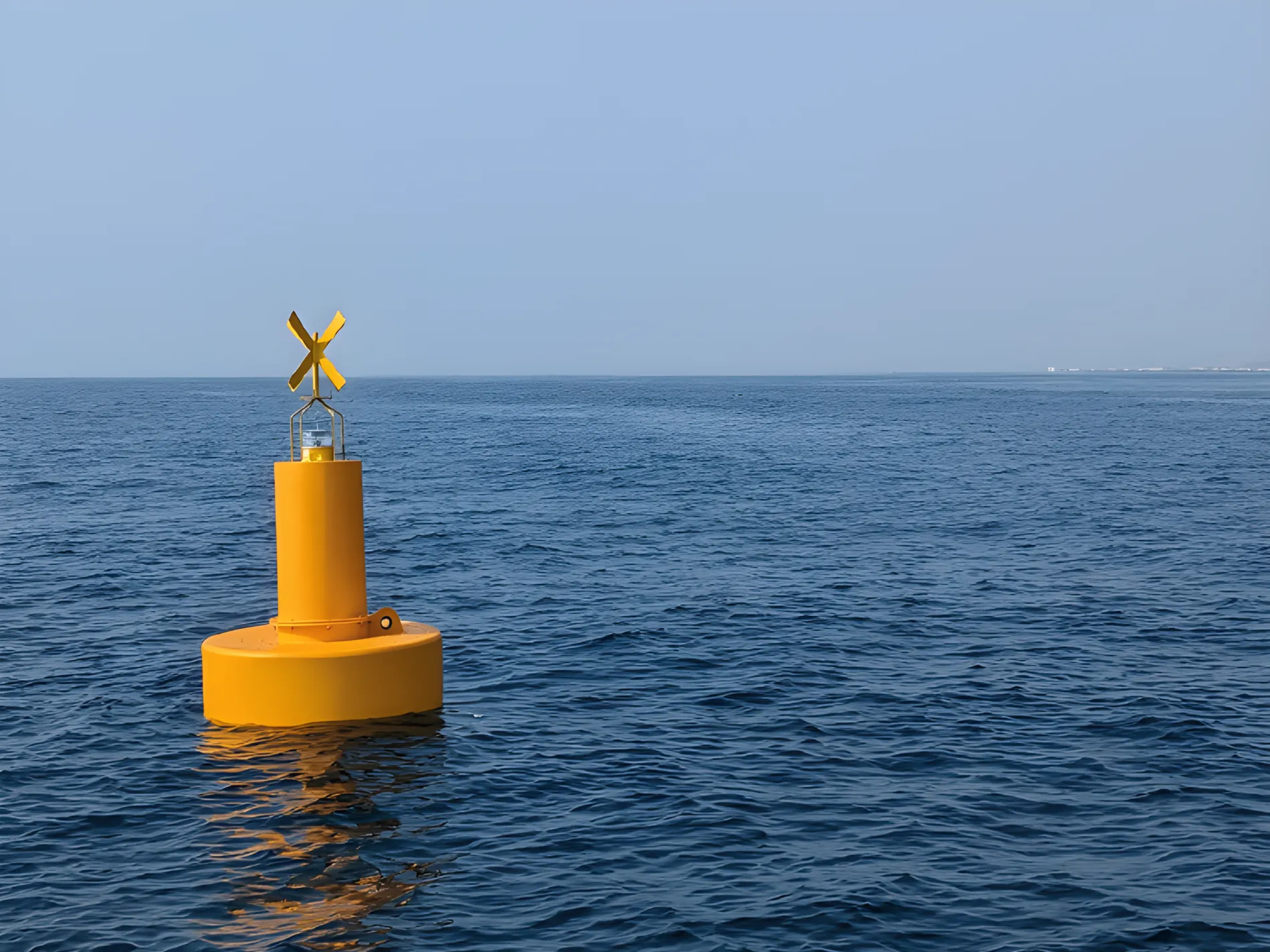Yellow navigation buoy on open water