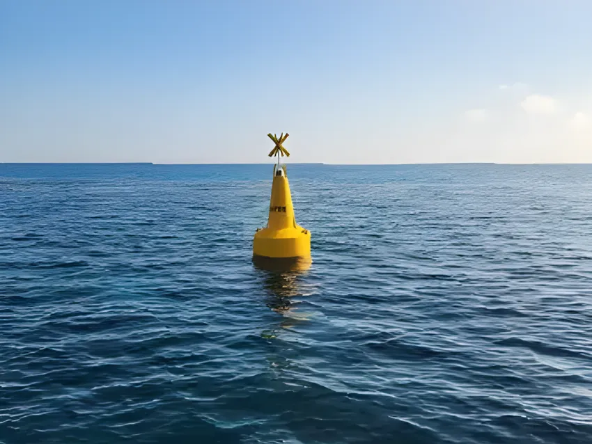 Yellow navigation buoy on open water