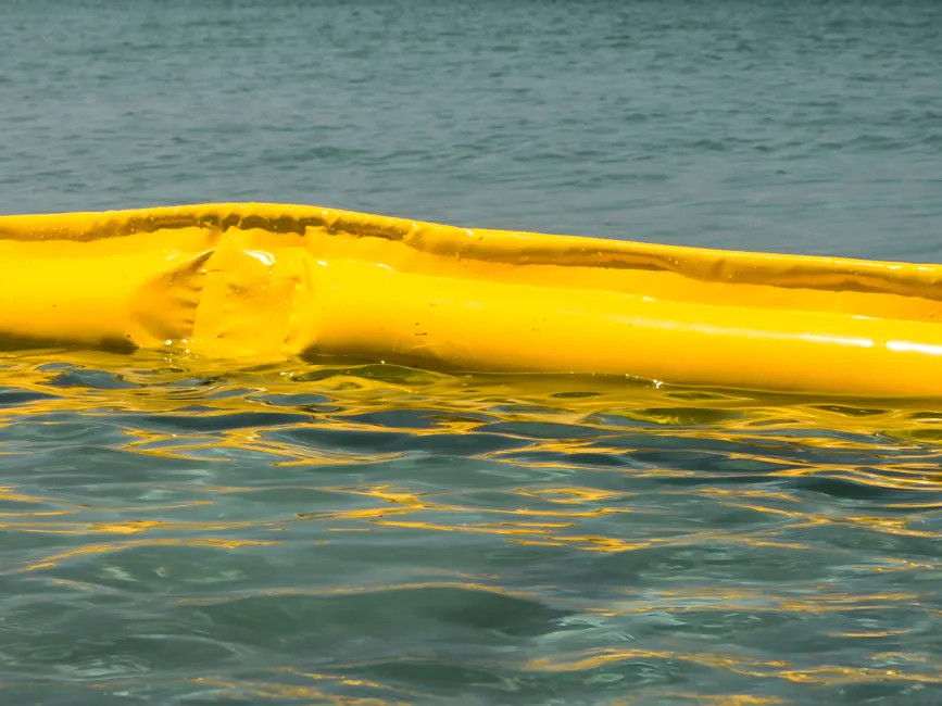 Floating oil boom on water for oil spill containment