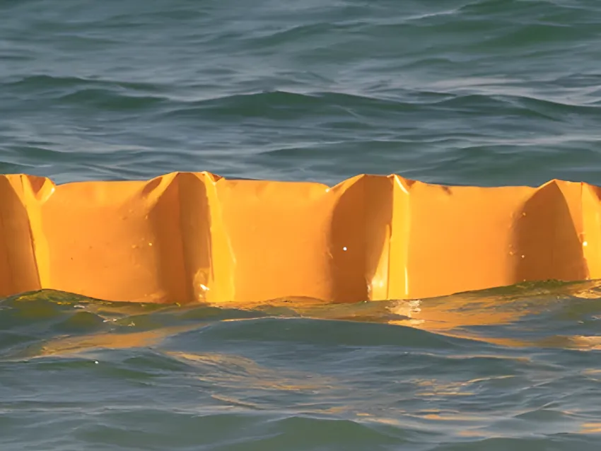 Floating oil containment boom on water for spill control
