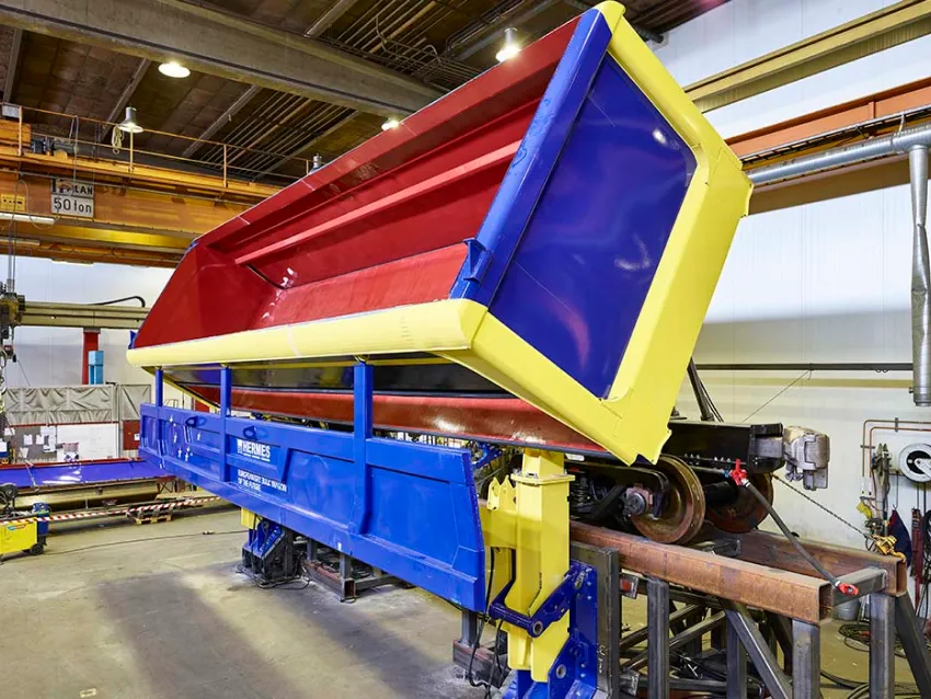 Side dumper freight wagon in workshop
