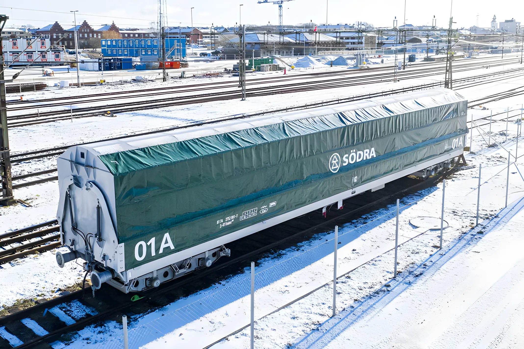 Side loader freight wagon on snowy rail yard