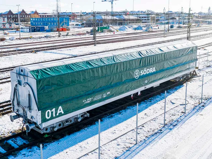 Side loader freight wagon on rail yard