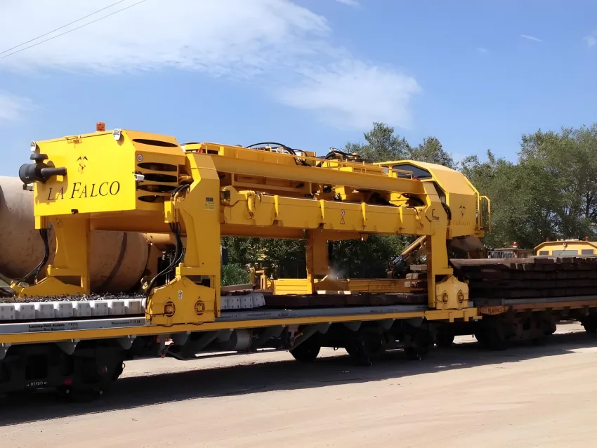 Sleeper gantry carrying railway sleepers for track maintenance.