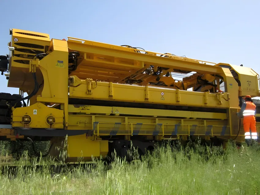 Sleeper gantry handling railway sleepers during track work.