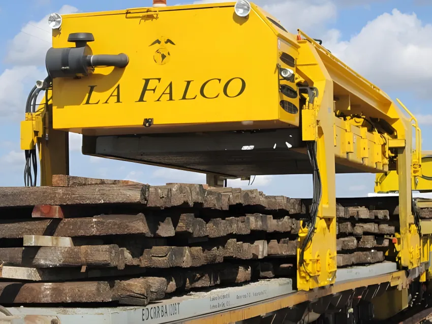 Sleeper gantry lifting railway sleepers for transport.