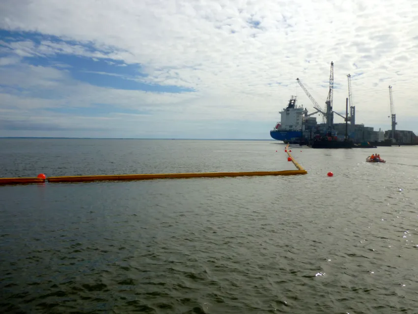 Turbidity curtain installed near marine construction for sediment control.
