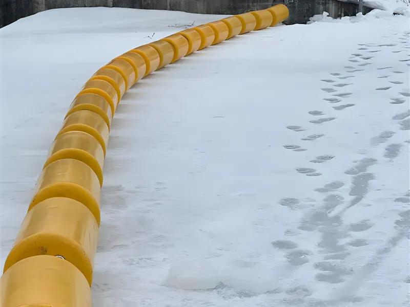 Waterway barrier installed in snowy conditions for watercraft safety