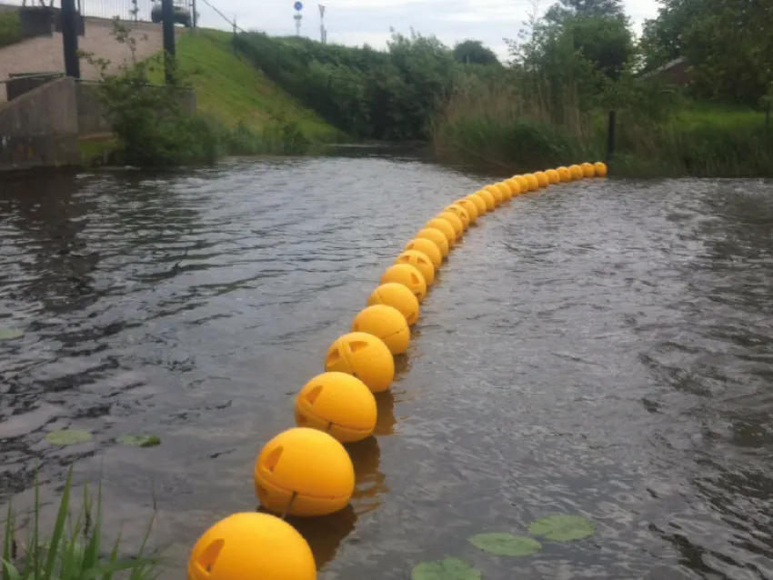 River boom installed as a waterway barrier for watercraft safety