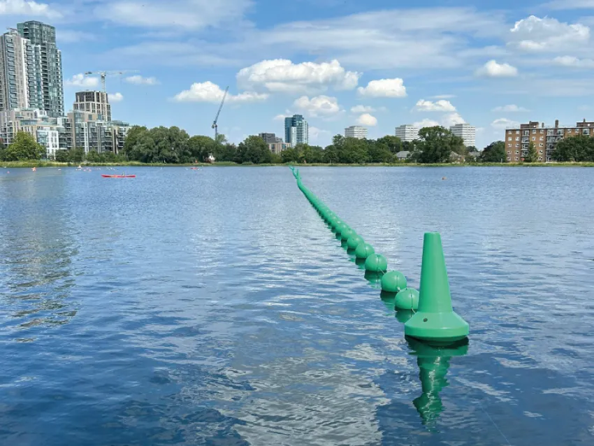Waterway barrier installed on an urban lake for watercraft safety and traffic control